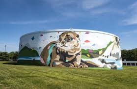 Winston-Salem ground storage tank with a large river otter mural